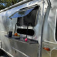 Side profile of Airstream showcasing rugged design and thick tires