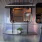 Rear view of an Airstream electric parked outside Airboardshop