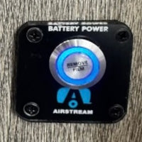 Airboard scooter displayed in industrial setting with close-up view
