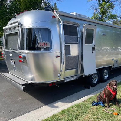 Scooter parked on gravel with wide handlebars and upgraded features
